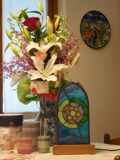 Stained glass table lamp, handmade by Pierangelo Tosi. Painted ceramic plate by Laura Gail Sweeney.